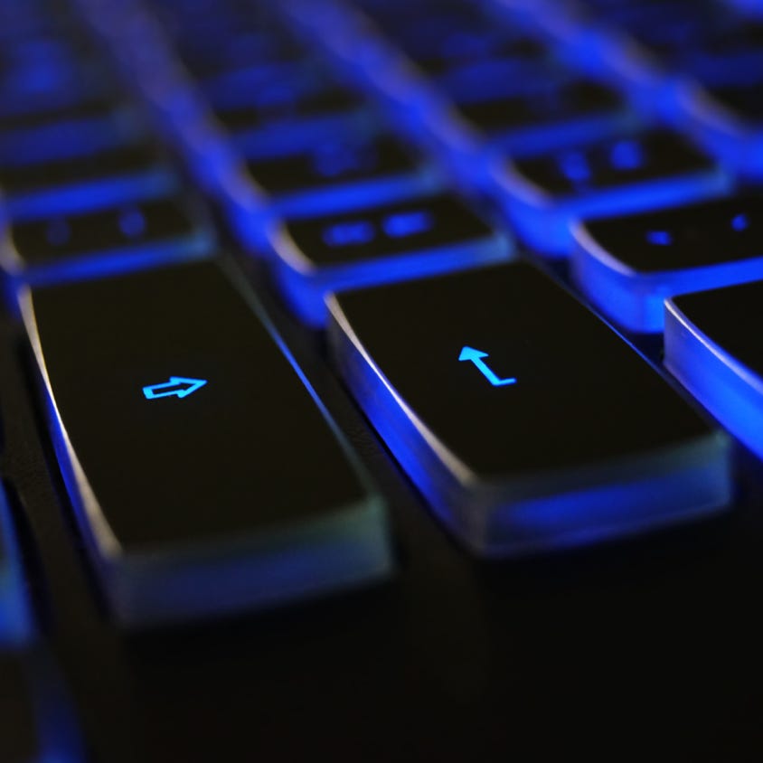 Closeup Photo of Black and Blue Keyboard